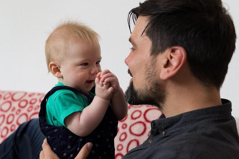 Dad singing to toddler